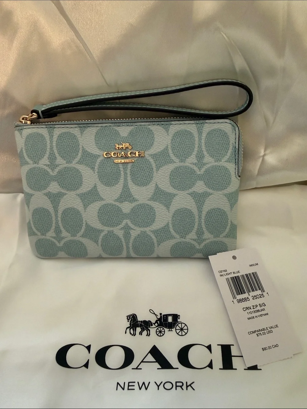 Coach wristlet featuring
